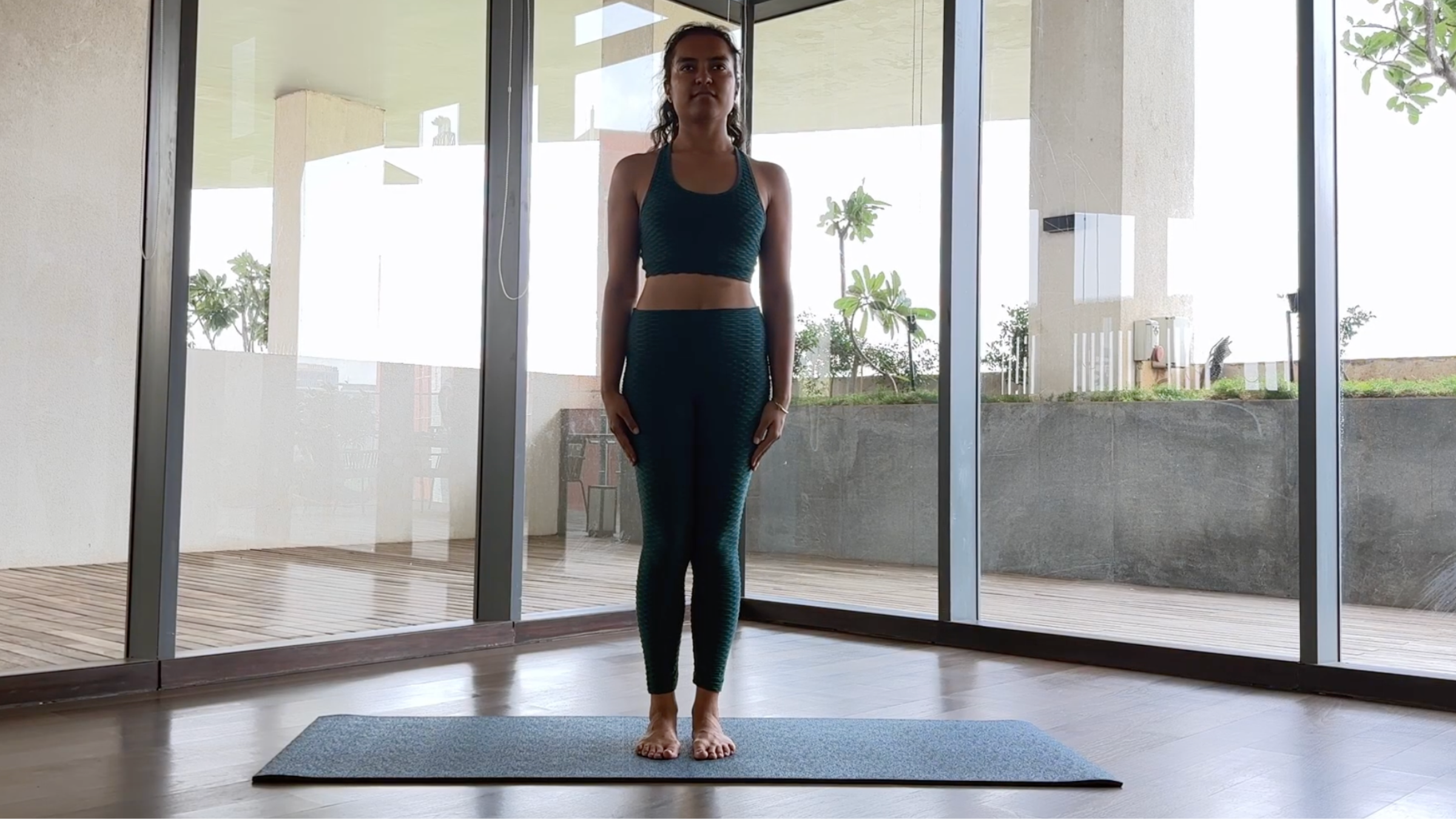 Rhea Davda practices mountain pose.